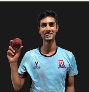 Rikhil holding a cricket ball